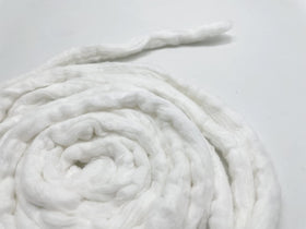Ivie cotton coil size comparison with hand demonstrating length and scale benefit