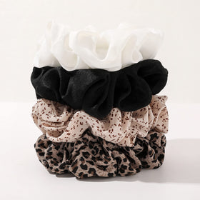 ivyu scrunchie in a bun in a lifestyle setting offering polished look