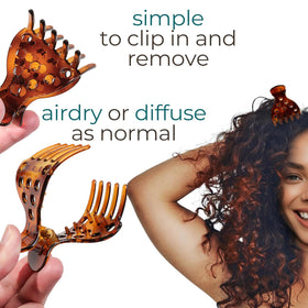 Ivyu clips holding curly hair to create volume and shape
