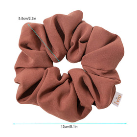 Ivyu scrunchie on curly ponytail displaying strong hold and reduced creasing
