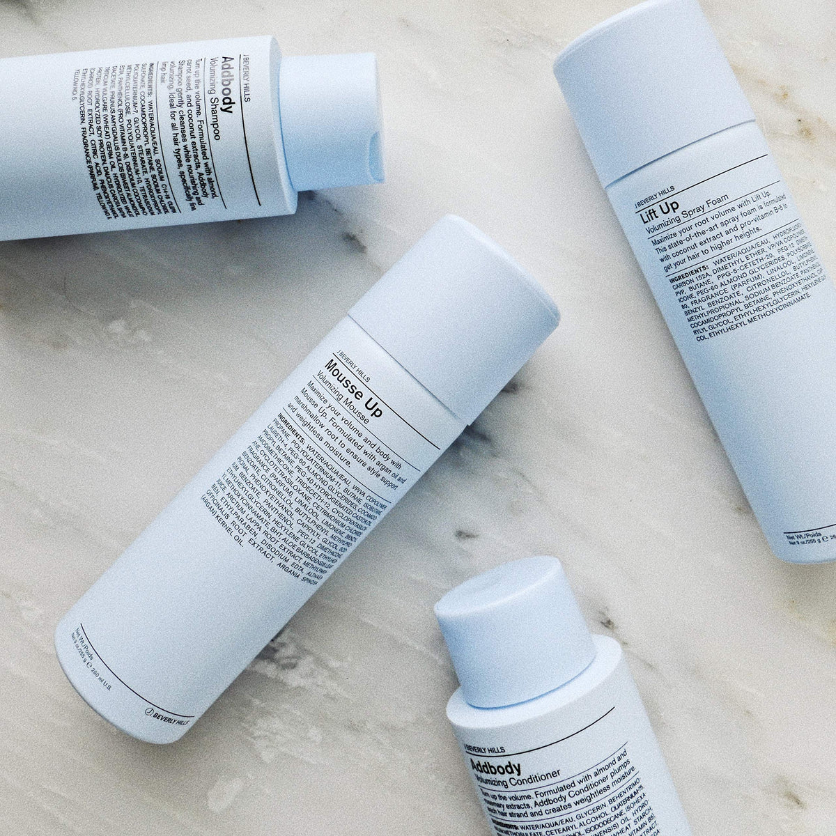 J Beverly Hills shampoo in-shower scene illustrating effortless volume while washing