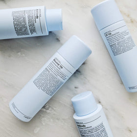 J Beverly Hills shampoo in-shower scene illustrating effortless volume while washing