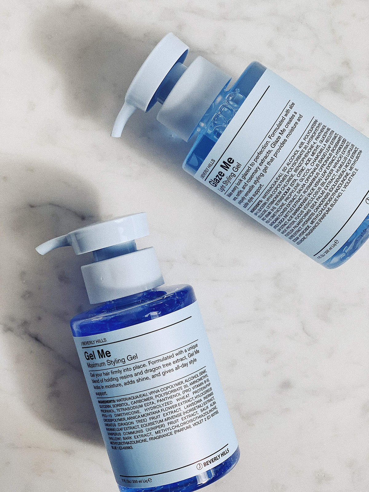 J Beverly Hills jar beside hand for scale displaying 7 oz capacity and portable size