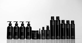J Beverly Hills applying cream to damp hair for smoother styling