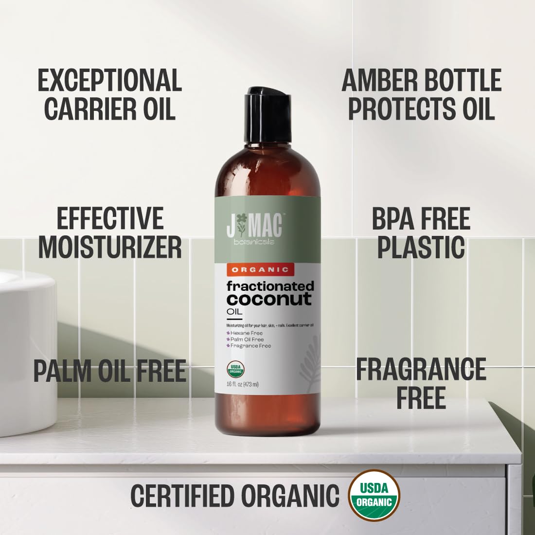 j mac botanicals bottle held in hand to show true 16 ounce scale and convenience