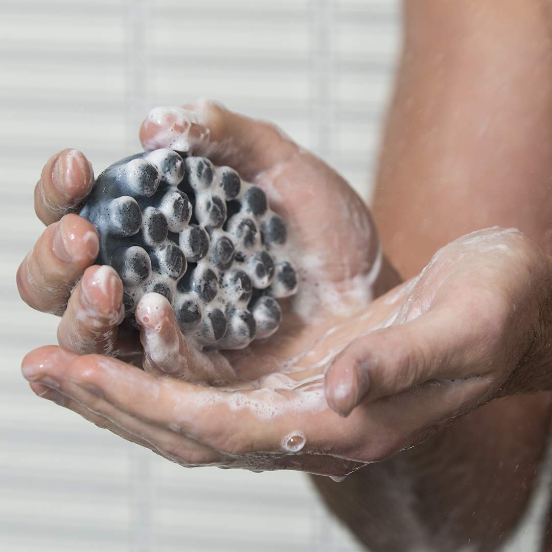 Jack Black close-up of raised nubs and jojoba beads texture, demonstrates massage exfoliation benefit
