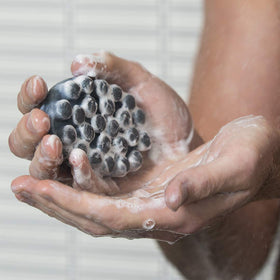 Jack Black close-up of raised nubs and jojoba beads texture, demonstrates massage exfoliation benefit