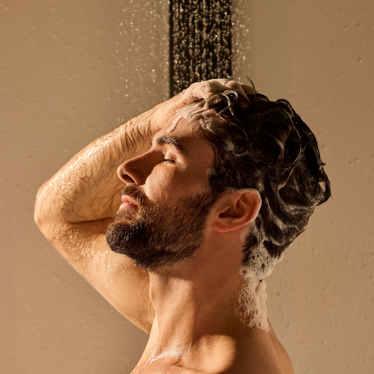 Jack Black in-shower lifestyle scene showing fast, effective removal of oil and buildup