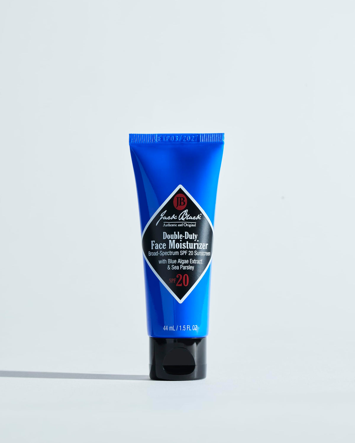 Jack Black Face Buff scrub being applied to cheek to exfoliate and smooth skin before shaving