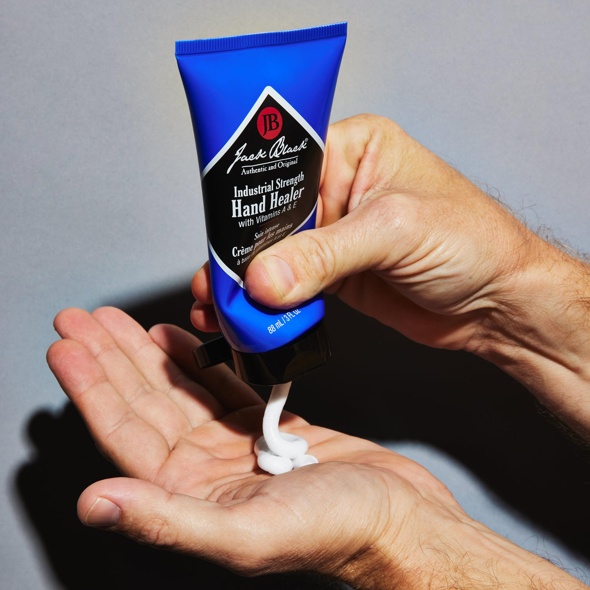 Jack Black being applied to hands demonstrating fast absorption and skin repair