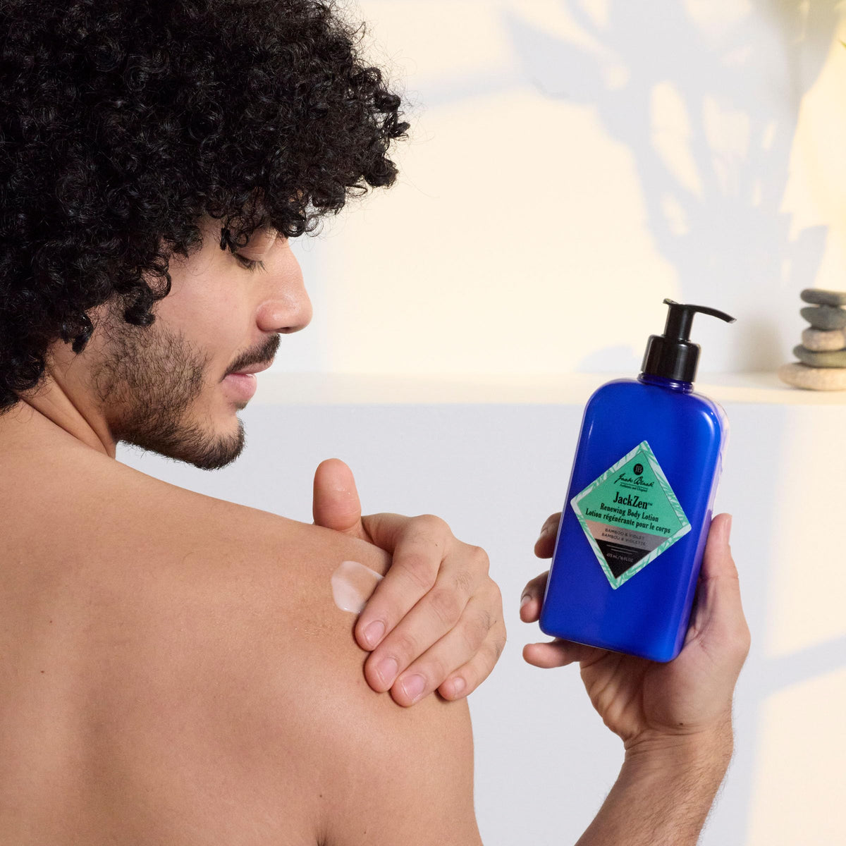 Jack Black Jackzen lotion applied on arm showing smooth finish - benefit: non-greasy absorption