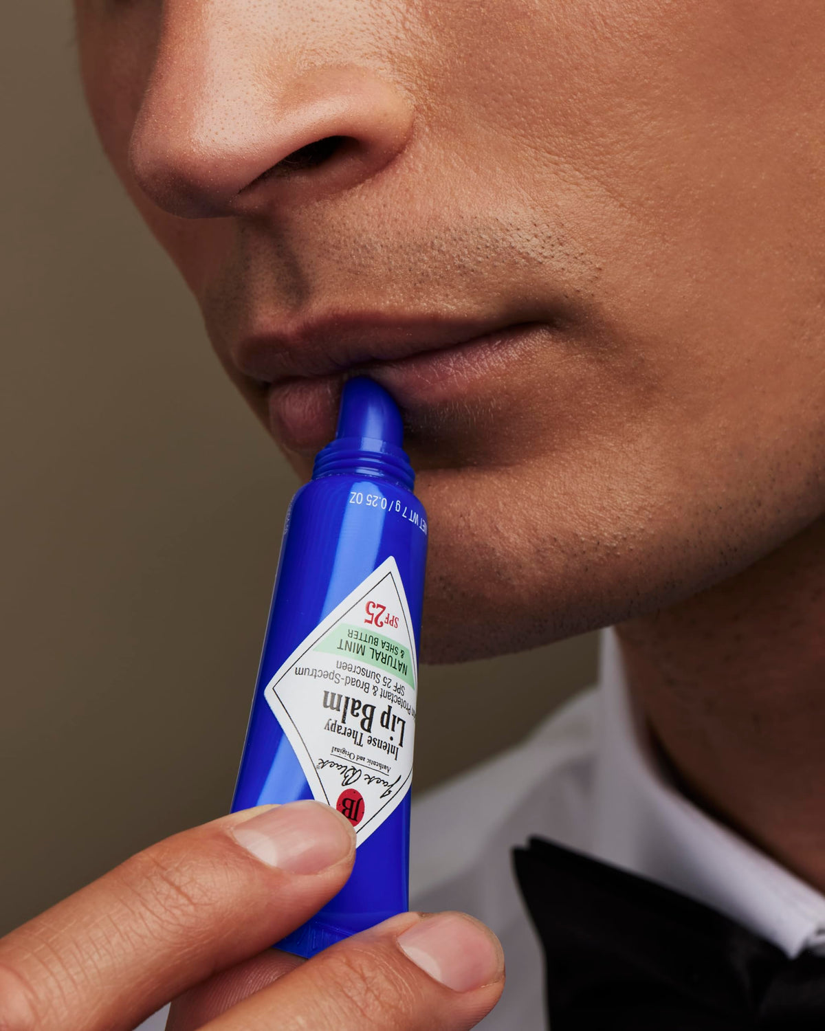 Jack Black lip balm cap open demonstrating easy application and on-the-go use