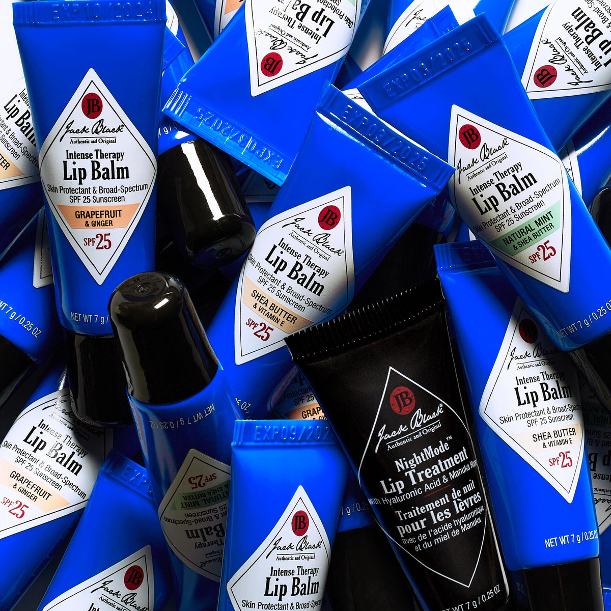 Jack Black tubes next to a wallet showing portable size and everyday convenience