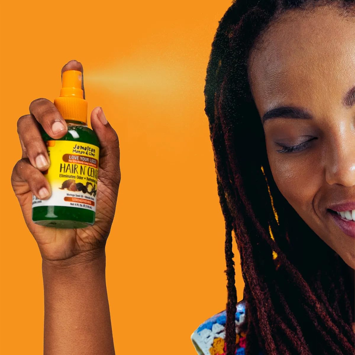 Jamaican Mango & Lime bottle in hand showing 4 oz travel-friendly scale