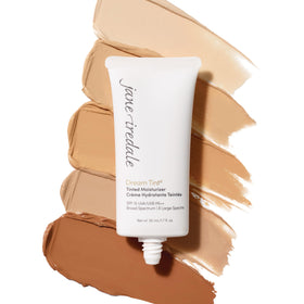 jane iredale Dream Tint beside coin for scale showing 1.7 oz travel-friendly size
