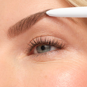 jane iredale PureBrow held in hand to show compact size and portability