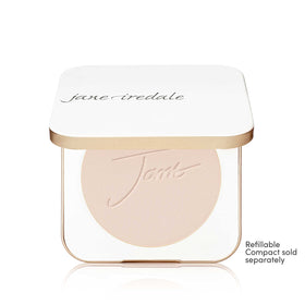 jane iredale brush applying ivory powder illustrating buildable coverage control