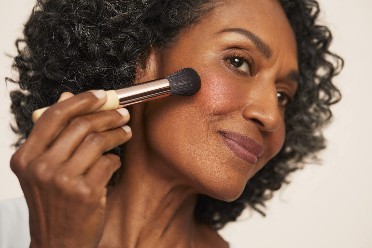 jane iredale blush applied with brush for buildable color