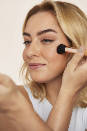 jane iredale swatch on arm showing buildable pigment and true-to-tone color