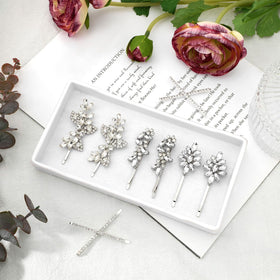 Janinka clips next to a ruler for scale, clarifies size for styling decisions