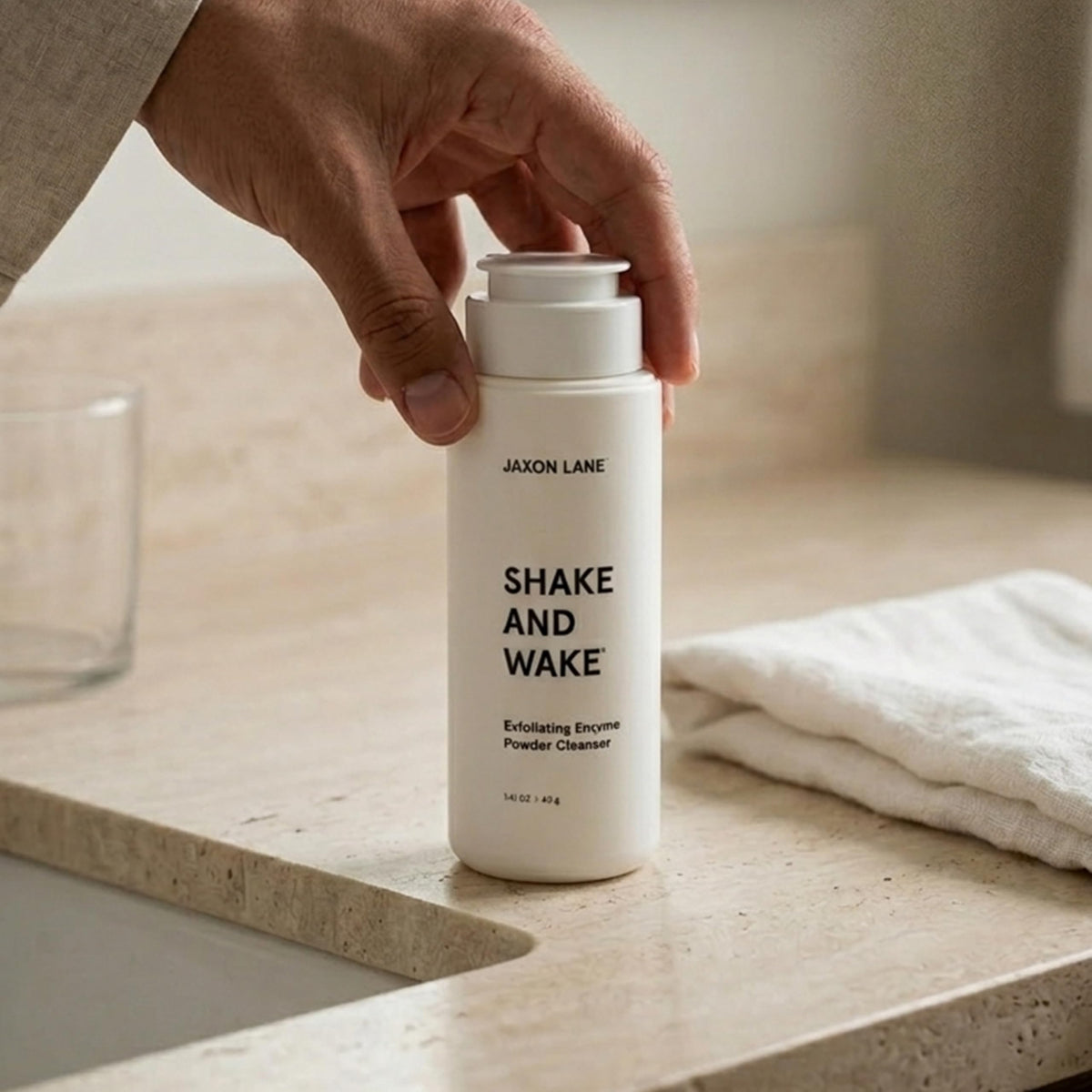 JAXON LANE creating soft foam in palm for a cushioned, non-abrasive cleanse