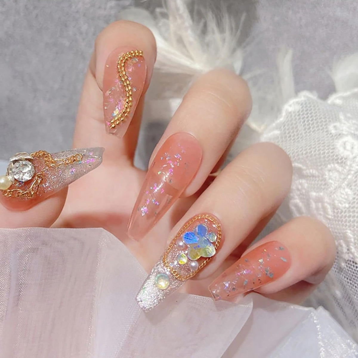 JERCLITY chains applied on nails in a salon setting demonstrating precise placement and glam effect