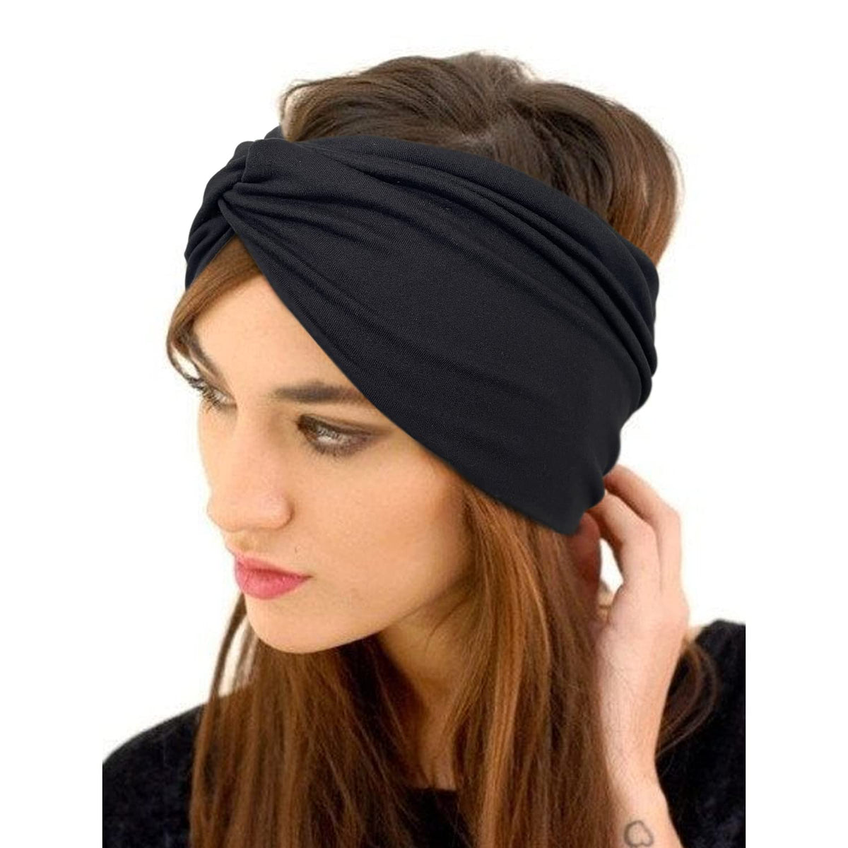 Jesries headband beside a ruler showing size and stretch for proper fit