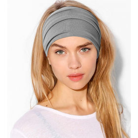Jesries headband beside ruler showing stretch and fit for large hair benefit