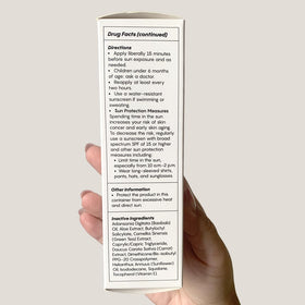 JESS BEAUTY tube next to sunglasses showing portable 1.7 fl oz convenience