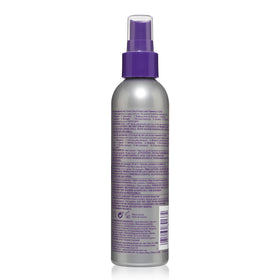 jhirmack being applied to wet hair for detangling and smoothing benefits