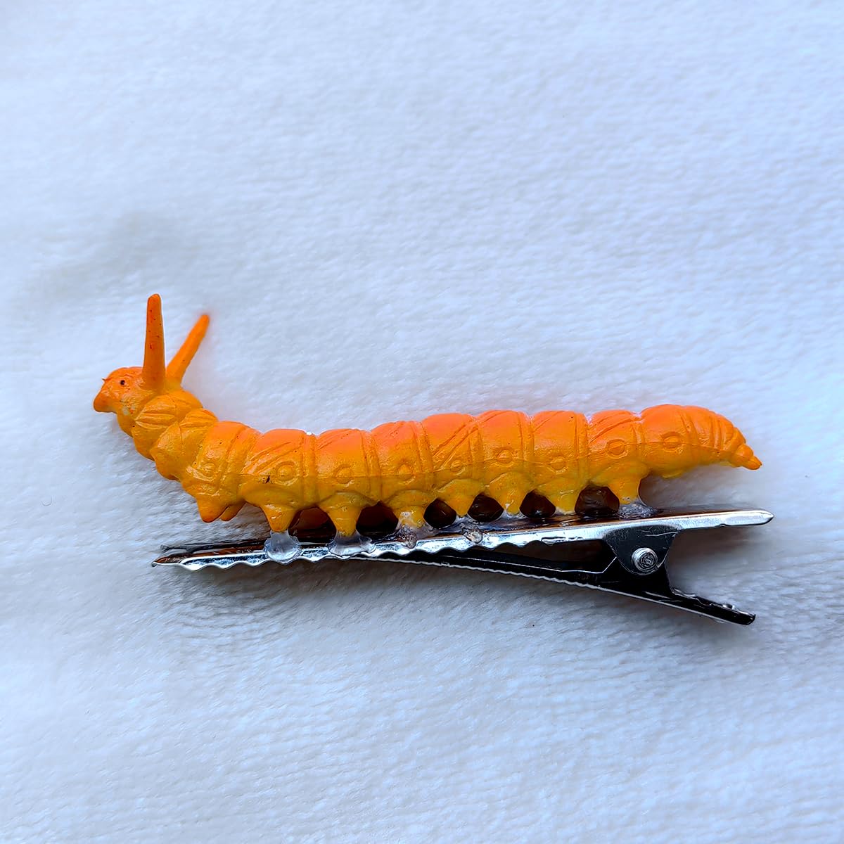 JINBUYAO clip worn in hair adding playful accent to hairstyle