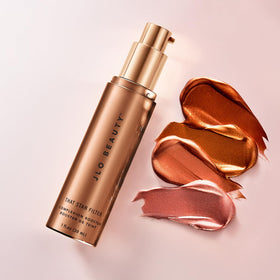JLO BEAUTY label close-up emphasizing vitamin E and skin-conditioning benefits