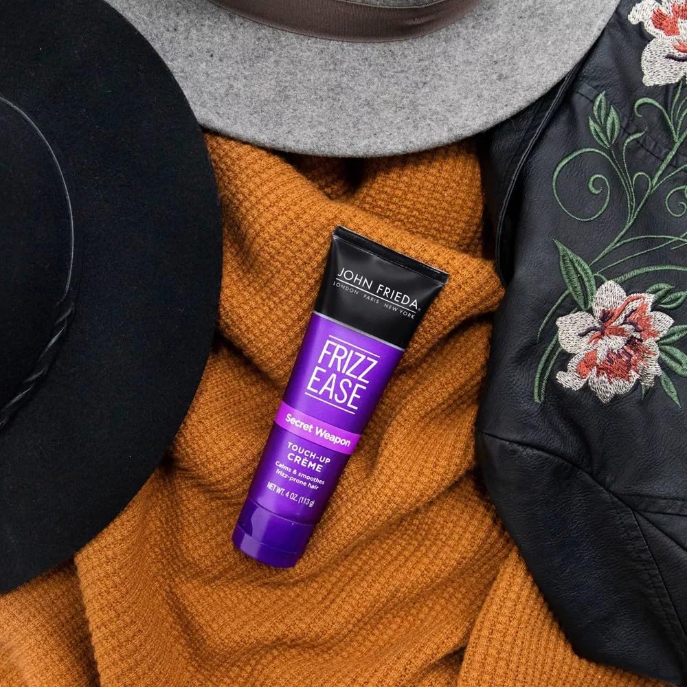John Frieda application on fingertips showing controlled frizz control