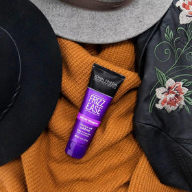 John Frieda application on fingertips showing controlled frizz control