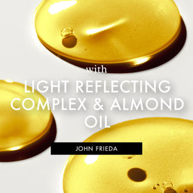 John Frieda bottle next to conditioner for optimal system use