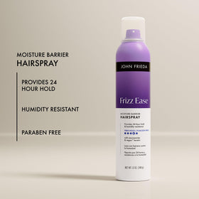 John Frieda spray in use on model providing humidity protection