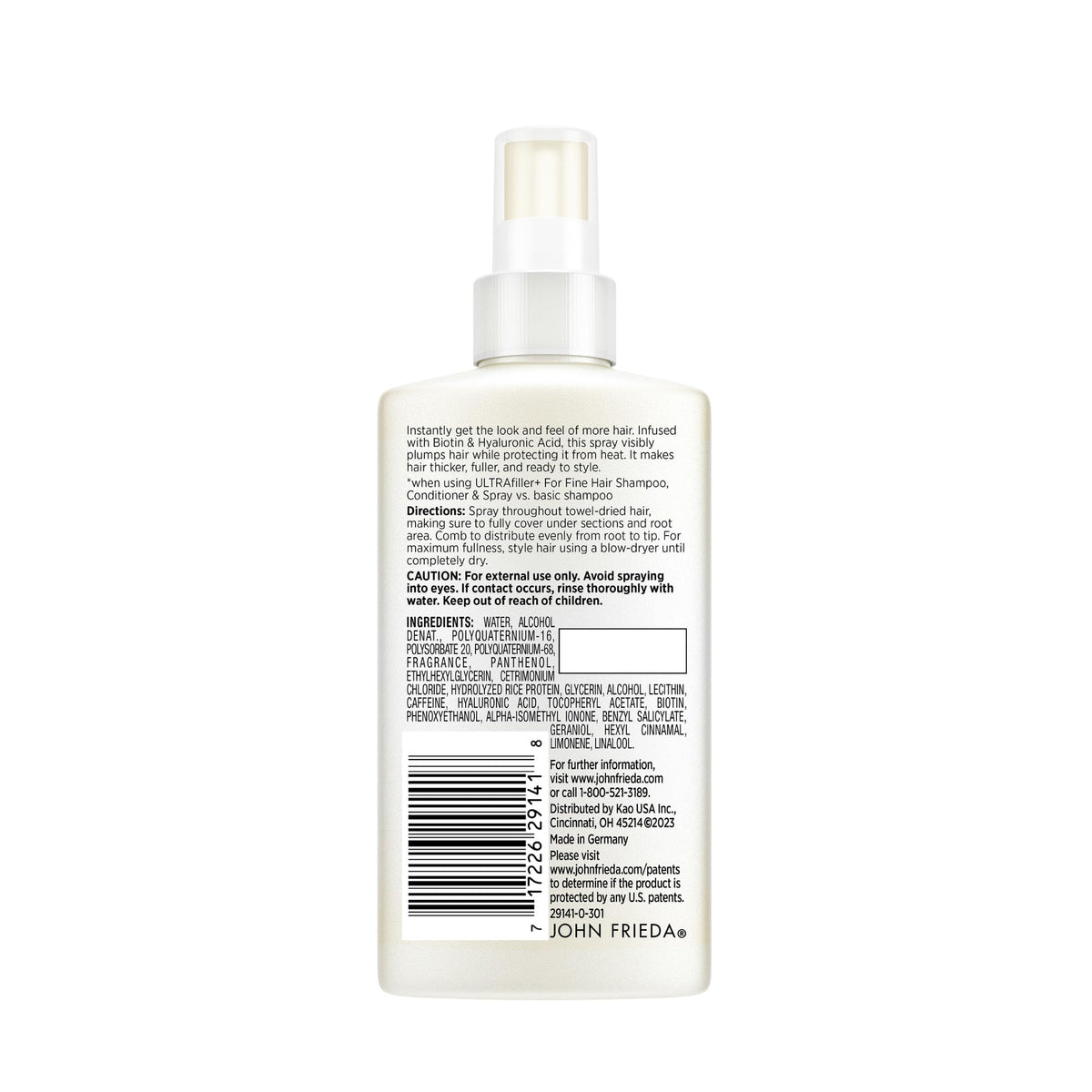 Heat styling with John Frieda spray protecting fragile hair during blow-dry