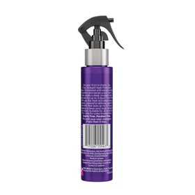 John Frieda bottle on bathroom counter with styling tools for routine