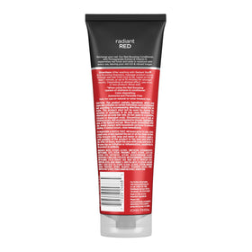 John Frieda on bathroom shelf conveying salon-quality routine