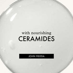 John Frieda bottle in hand for scale to show convenient 8 fl oz size