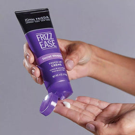 John Frieda beside travel items showing compact, on-the-go benefit