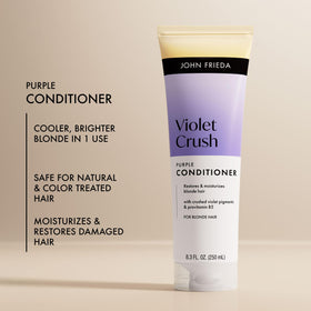 John Frieda bottle dispensing conditioner into hand for easy application