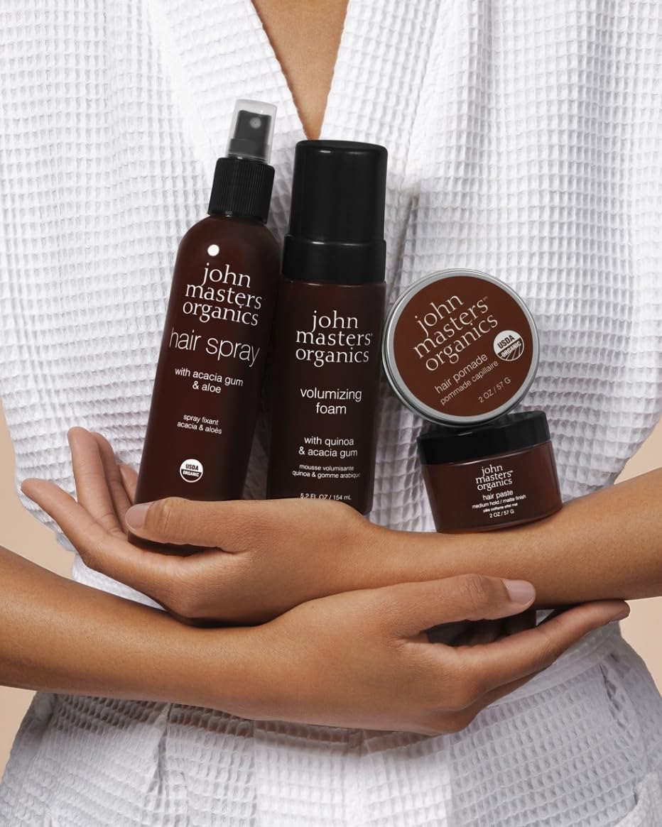 john masters organics application on hands showing easy spread and workable styling benefit