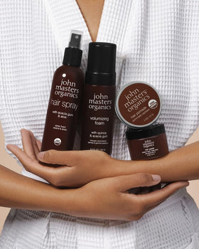 john masters organics application on hands showing easy spread and workable styling benefit