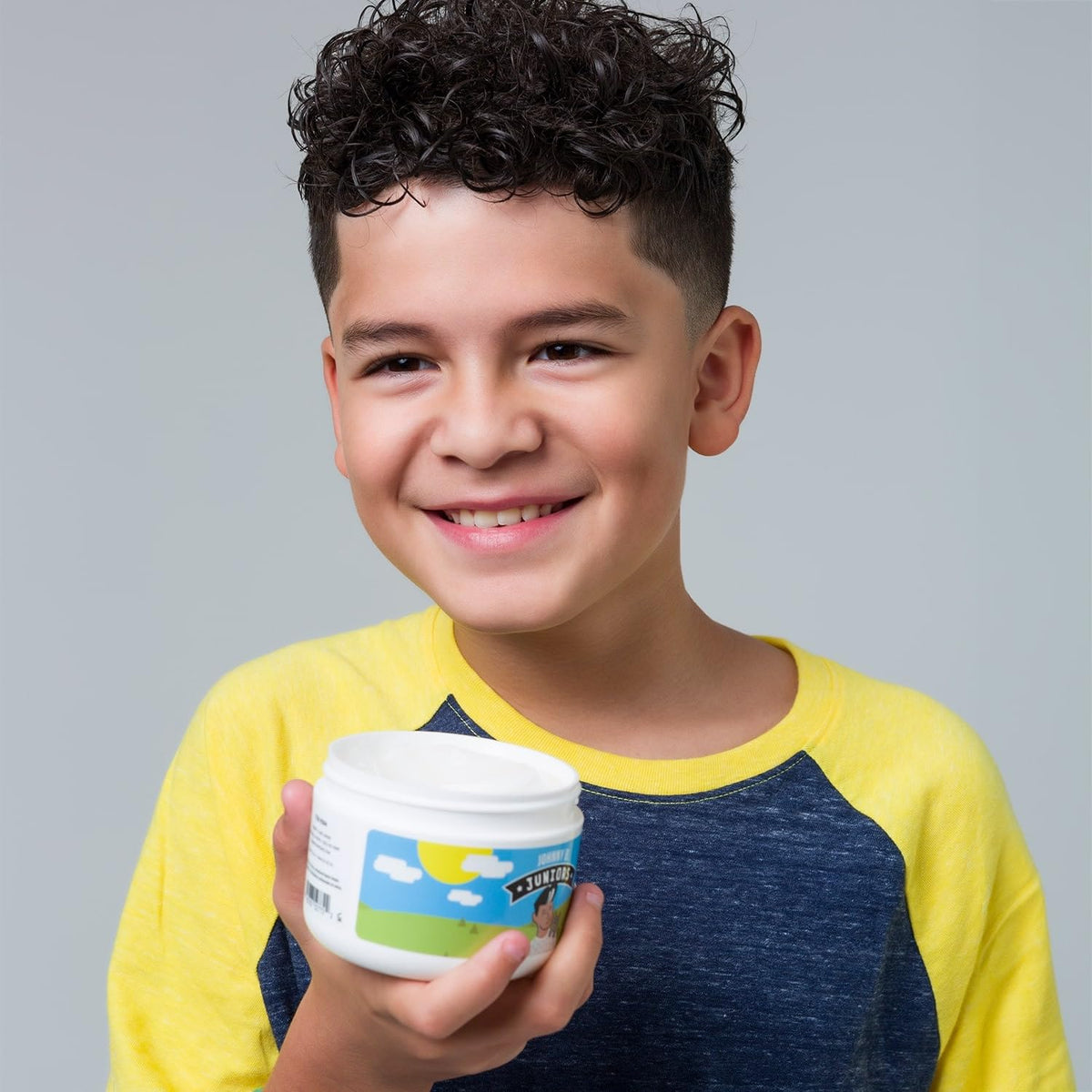 Close-up of JOHNNY B. label highlighting medium hold and allergen-free benefits