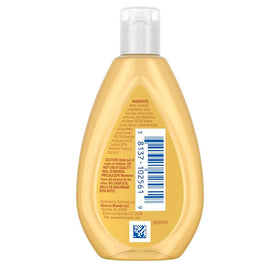 Johnson's Baby bottle next to coin for 1.7 oz size reference