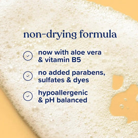 Parent rinsing baby hair with Johnson's Baby for calm bath time