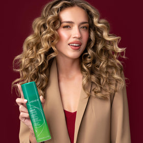 Joico Body Shake 250mL bottle held in hand for size comparison