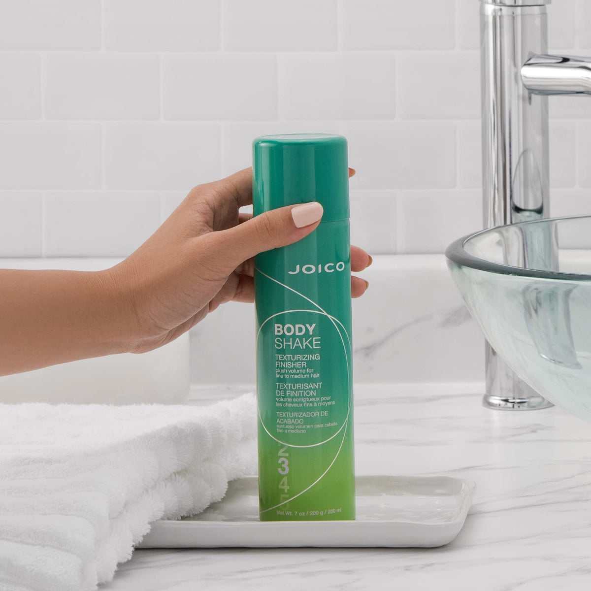 Joico Body Shake spray applied at roots for instant lift effect