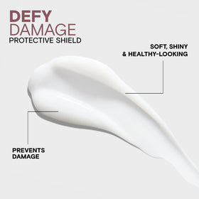 Joico Defy Damage applied to damp hair demonstrating even coverage benefit